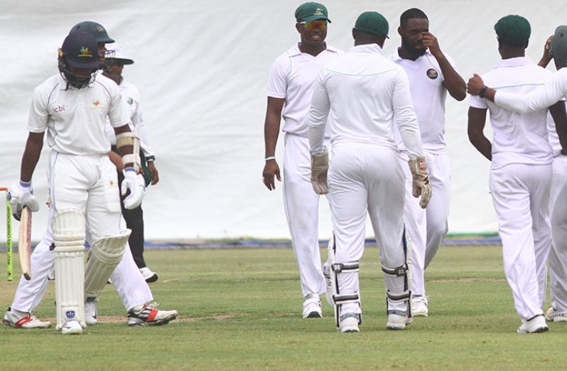 Aaron Jones makes his way back to the pavilion after he was removed by Raymon Reifer who finished with figures of 5-20.