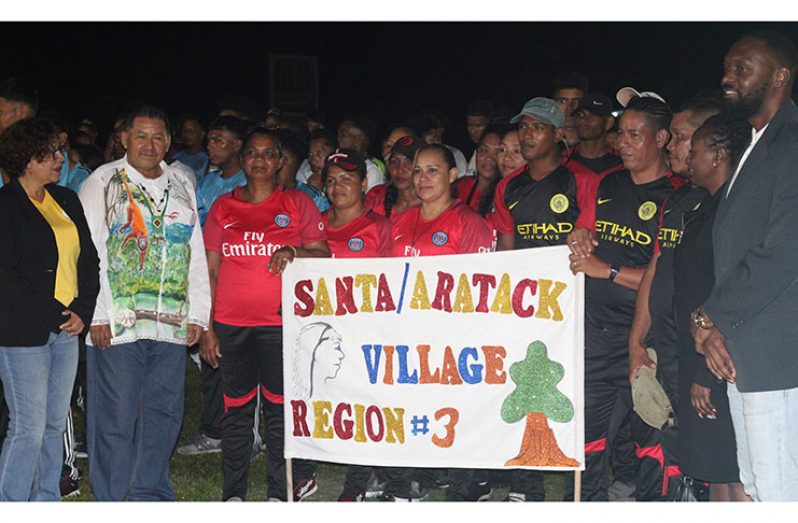 Ministers Valerie Garrido-Lowe and Sydney Allicock (left) and Director of Sport Christopher Jones
(far right) with members of the Santa Aratack (Region 3) team.