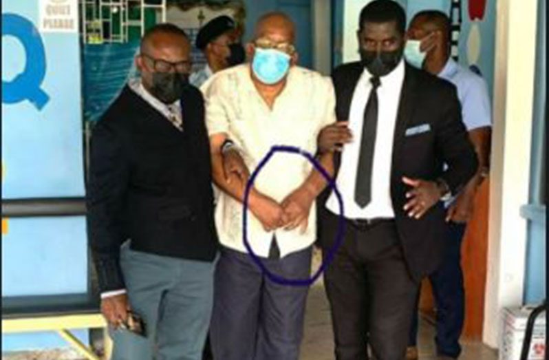 Former Finance Minister, Winston Jordan escorted by his lawyers as he claimed to be unwell