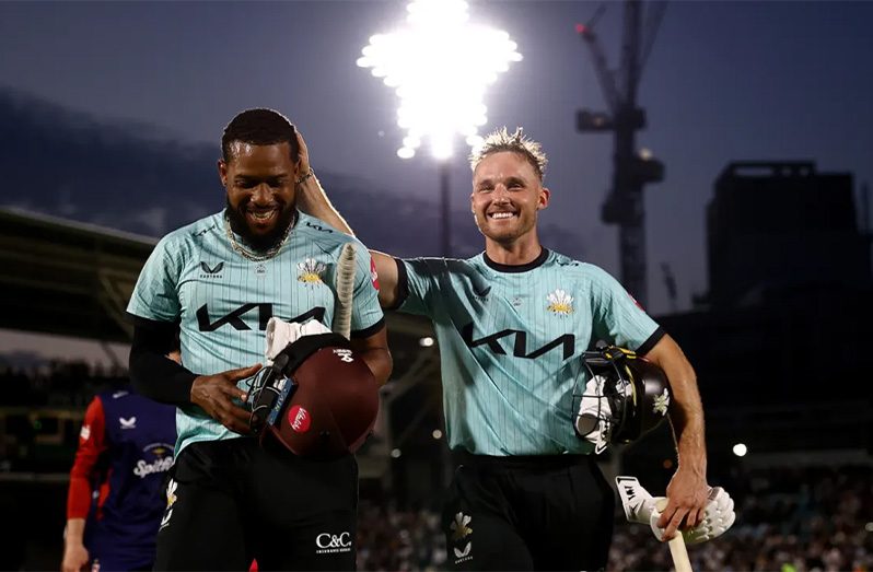 Chris Jordan and Laurie Evans walk off after sealing victory  •  Surrey CCC/Getty Images
