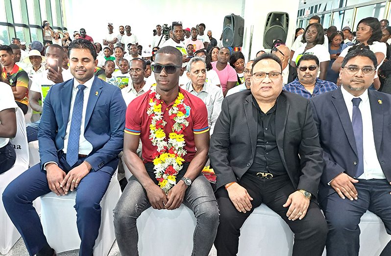 Shamar Joseph (centre) flanked by the Minister of Culture, Youth and Sport Charles Ramson (left) and GCB President Bissoondyal Singh