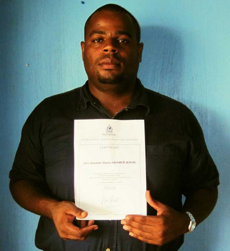 Detective Sergeant Julio Jonas with his international certification in cyber security