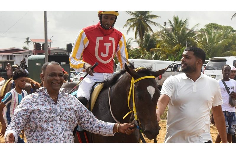 Damain Dharamjit (left), Jockey Colin Ross, and Nasrudeen Mohamed Jr. (right)