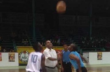 Minister of Sport Dr Frank Anthony tosses the ball to signal the start of the NSBF and the game between President’s College and St Rose’s High on Sunday