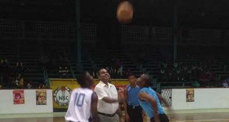 Minister of Sport Dr Frank Anthony tosses the ball to signal the start of the NSBF and the game between President’s College and St Rose’s High on Sunday