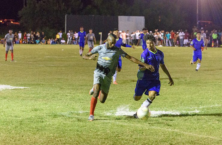 A Port Kaituma player (grey) and a Guyana Rush Saints defender (blue) tussle for the ball in the final of the Indigenous Heritage Games football competition, which was eventually won by the Guyana Rush Saints of Region 9. (Samuel Maughn photo)