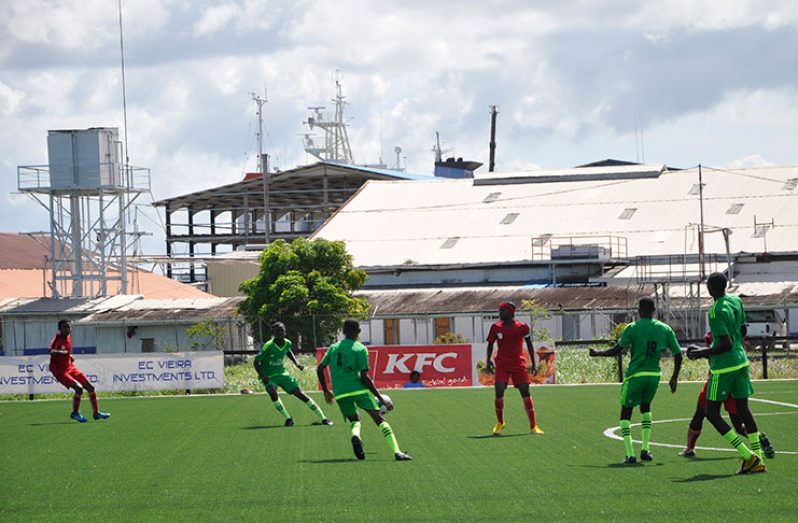 Action in the Beacon FC (red) vs Eastveldt FC match at GFF National Training Centre.
