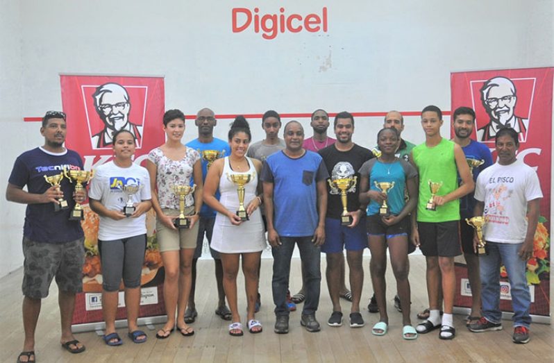 KFC Operations Manager Gregory DeGanes is flanked by women's open winner,  Ashley Khalil and Men's Open Winner, Jason Ray Khalil and the prize winners at the Georgetown Club yesterday (Sean Devers photo)