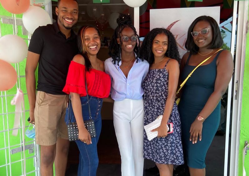 Owner of Khayr Organics, Earlecia Hierynomo (third from left)
with customers during the opening ceremony of the stor