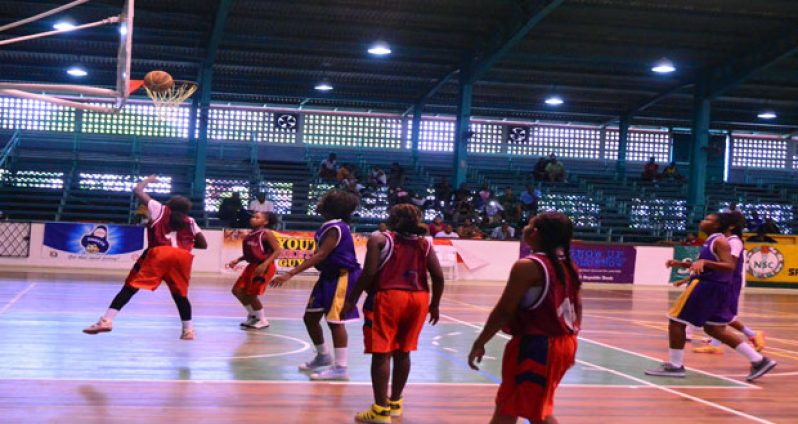 Kwakwani Secondary’s Kenesha Leacock (#1) goes for a lay-up yesterday in the National Schools Basketball Festival at the Cliff Anderson Sports Hall. (Adrian Narine photo)