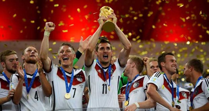 Miroslav Klose of Germany lifts the World Cup to celebrate with his teammates during the award ceremony after the 2014 FIFA World Cup Brazil Final match between Germany and Argentina at Maracana yesterday in Rio de Janeiro, Brazil. (Photo by Shaun Botterill - FIFA/FIFA via Getty Images)