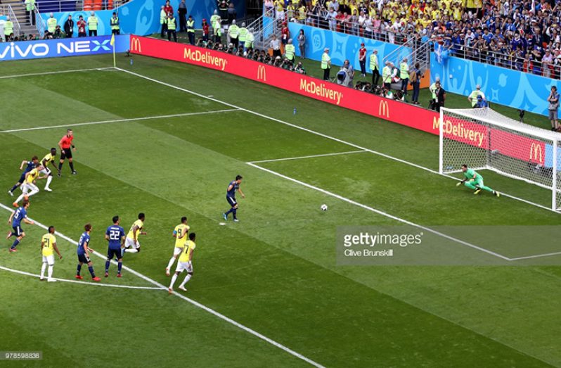 Shinji Kagawa of Japan scores his team's first goal past David Ospina of Colombia during the 2018 FIFA World Cup Russia Group H match against Colombia at Mordovia Arena yesterday in Saransk, Russia. (Photo by Clive Brunskill/Getty Images)