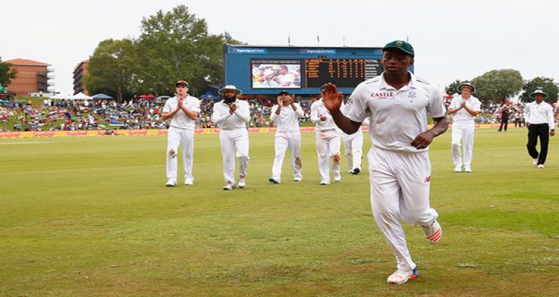 Fast bowler  Kagiso Rabada leads South Africa from the field after returning career-best figures of 7 for 112, on the third day at Centurion.