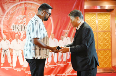 President Irfaan Ali collects an honorary belt from the GCK president, Sensei Frank-Woon-A- Tai