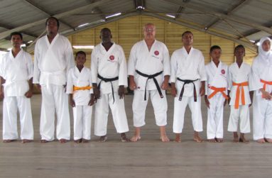 Senseis Khouri, Moriah and Ali are flanked by the newly promoted karatekas at the Trinity Street Dojo in New Amsterdam.