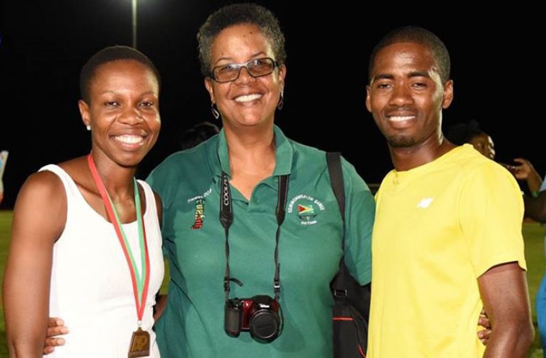 Dr. Karen Pilgrim (centre) with Guyana’s Commonwealth Games gold medallist, Aliann Pompey (left), and distance athlete, Cleveland Forde
