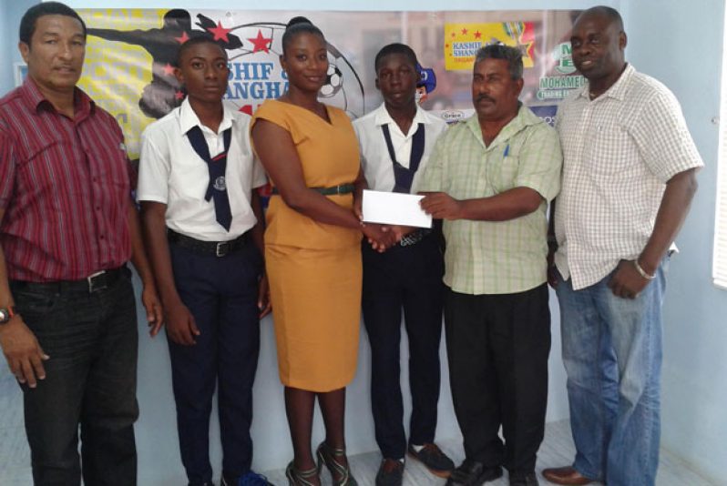 From left to right, Kashif Muhammad, Anthony Jacobs, Teacher and Coach of Uitvlugt Secondary School, Chevon Monchoir, receiving sponsorship from general manager, Mr. Patty Ramlall, Shaquil Mounter, and Aubrey "Shanghai" Major.