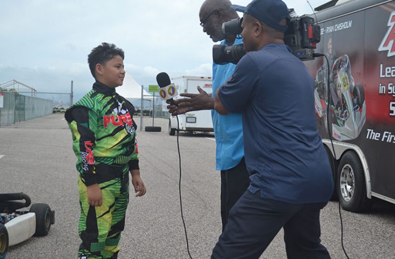 Jeremy Ten Pow being interviewed by the Jamaican press during yesterday's session.