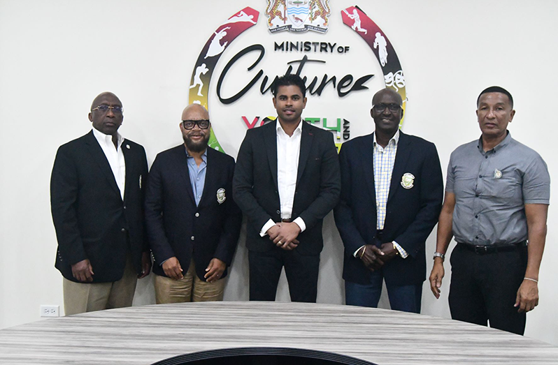 Minister of Sport, Honourable Charles Ramson Jr is flanked by ExCo Members of the Pele FC Alumni Corporation. From left, Denis Carrington, Patrick ‘Labba’ Barton, Eric ‘Riggy’ Smith and NSC Chairman, Kashif Muhammad