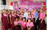 First Lady Arya Ali (centre) flanked by Kato Secondary School students during the launch of the menstrual hygiene initiative in Region 8