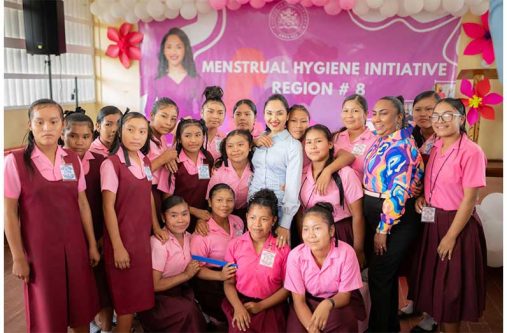 First Lady Arya Ali (centre) flanked by Kato Secondary School students during the launch of the menstrual hygiene initiative in Region 8