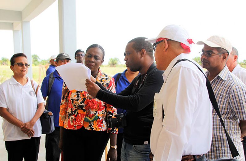 Minister of Education Nicolette Henry, and Minister of Social Cohesion, Dr. George Norton taking a look at the building plan for the school