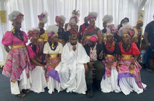 Unique Arts CEO Kelton Jennings (sitting, third from right) with President Dr. Irfaan Ali and some of his dancers following a performance