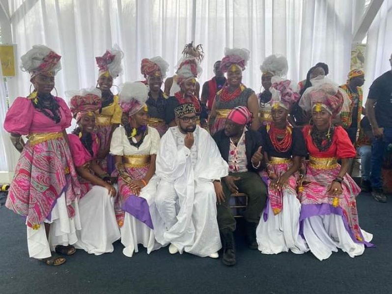 Unique Arts CEO Kelton Jennings (sitting, third from right) with President Dr. Irfaan Ali and some of his dancers following a performance