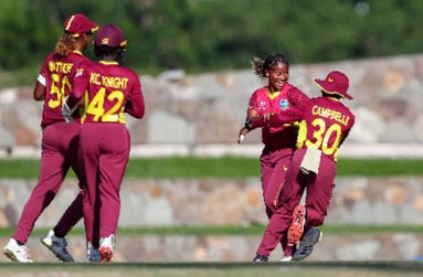 Kaysia Schultz (second from right) celebrates her first-ever ODI wicket with Shemaine Campbelle on Friday (Photo courtesy CWI Media)