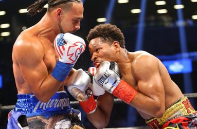Keith Thurman (left) was greeted by boos after defending his WBA welterweight title against Shawn Porter..