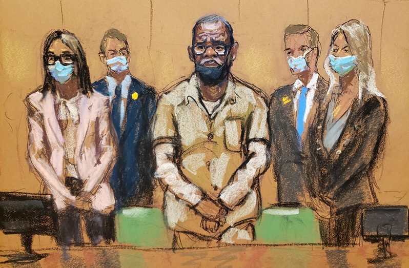 R. Kelly stands with his lawyers Jennifer Bonjean and Ashley Cohen during his sentencing hearing for federal sex trafficking at the Brooklyn Federal Courthouse in Brooklyn, New York, U.S., June 29, 2022 in this courtroom sketch. REUTERS/Jane Rosenberg