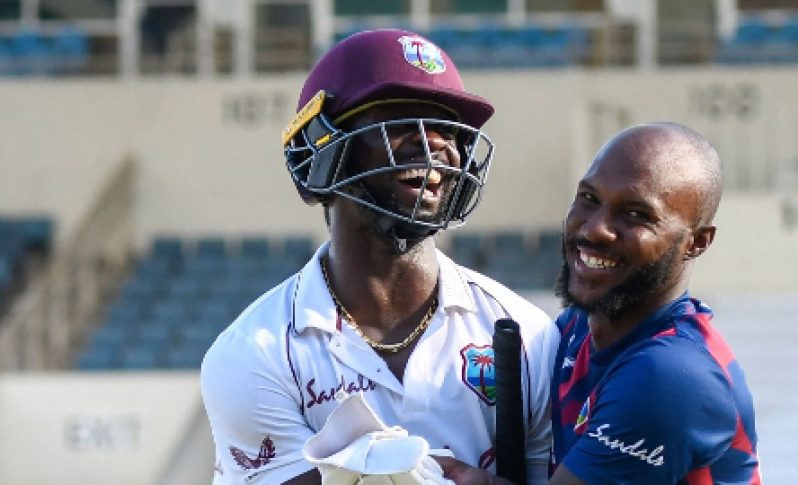 Vice-captain Jermaine Blackwood (right) congratulates hero Kemar Roach following Sunday’s Test win at Sabina Park.