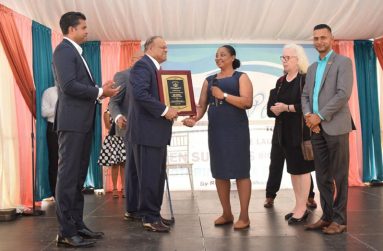 Ken Subraj flanked by Minister of Culture Youth and Sport, Charles Ramson, Principal of GTI Renita Duncan and other notable personalities at the launching of his biography.