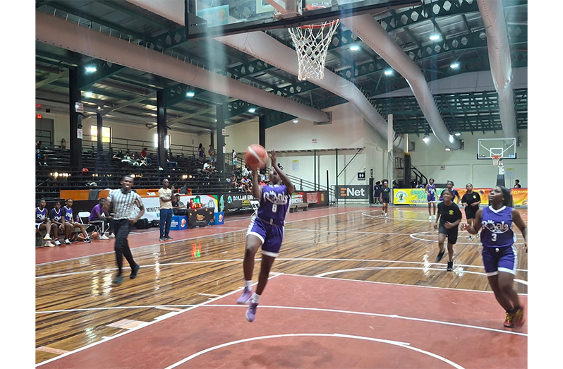 Kwakwani Secondary Kenesha Fraser going for a layup against Queen’s College