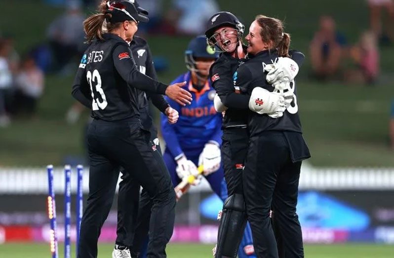 Amelia Kerr gets a bear hug from Katey Martin (ICC via Getty Image)