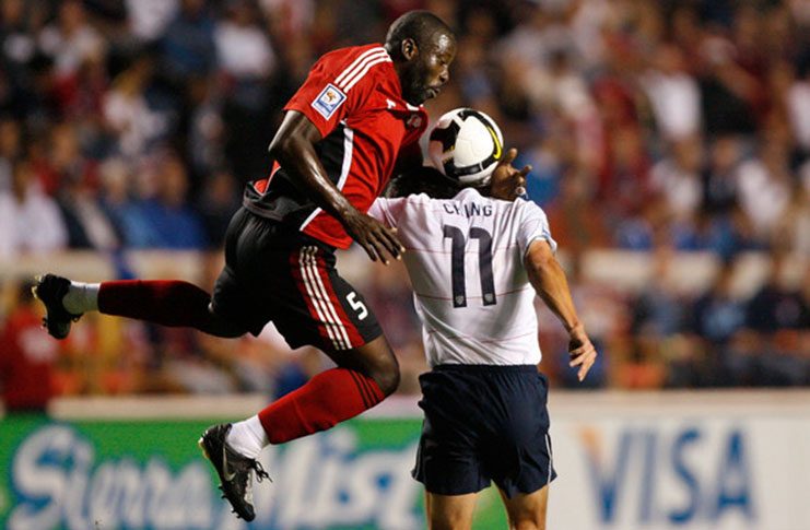 FLASHBACK: Defender Keyeno Thomas #5 of Trinidad & Tobago collides with forward Brian Ching #11 of the United States during the first half at Toyota Park on September 10, 2008 in Bridgeview, Illinois.