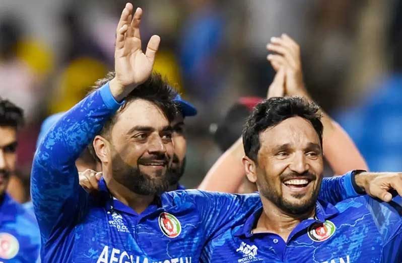 Rashid Khan and Gulbadin Naib soak in Afghanistan’s historic win (AFP/Getty Images)