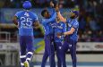 Khary Pierre (second left) celebrates the capture of one of his three wickets against the Antigua and Barbuda Falcons