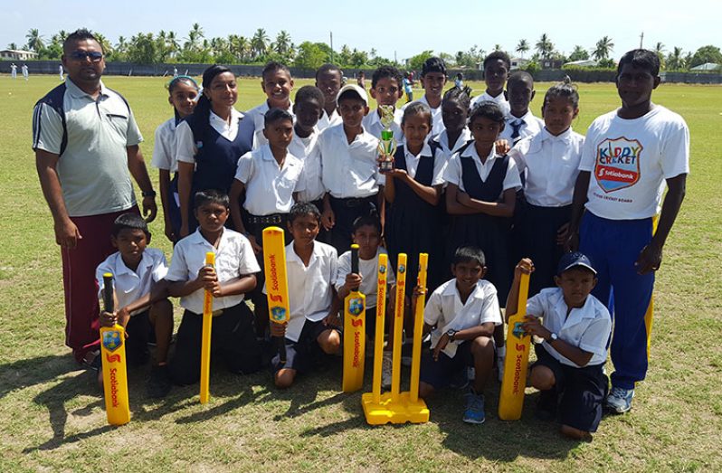 The winning Enterprise Primary School with teacher Videsh Lall (left) and coordinator of the zone, coach Latchman Yadram.