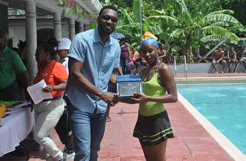 Faith King poses with her NSC PWD Sportswoman-of-the-Year 2017 Award along with Director of Sport Christopher Jones.