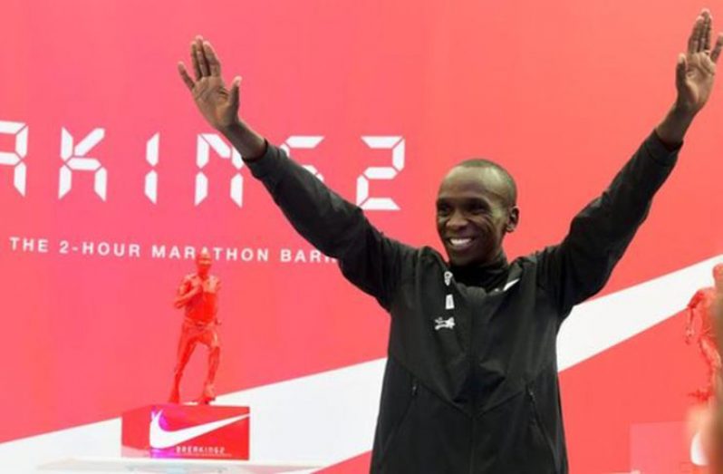 Eliud Kipchoge was presented with a trophy after his run which he said was "history"