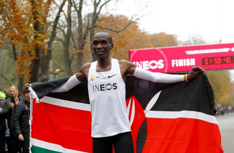 Kenya's Eliud Kipchoge, the marathon world record holder, celebrates after a successful attempt to run a marathon in under two hours in Vienna, Austria, last Saturday.  (REUTERS/Leonhard Foeger)