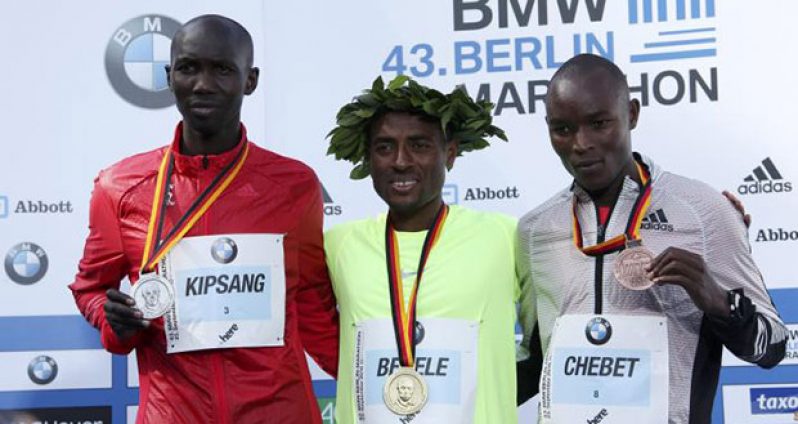 Second placed Wilson Kipsang (L to R) of Kenia, winner Kenenisa Bekele of Ethiopia and third-placed Evans Chebet of Kenia pose with their medals during the victory ceremony at the Berlin marathon in Berlin, Germany, yesterday. REUTERS/Fabrizio Bensch