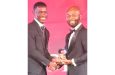 West Indies and Guyana speedster Shamar Joseph is seen receiving his award from CWI president Dr Kishore Shallow on Sunday night.