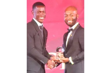 West Indies and Guyana speedster Shamar Joseph is seen receiving his award from CWI president Dr Kishore Shallow on Sunday night.