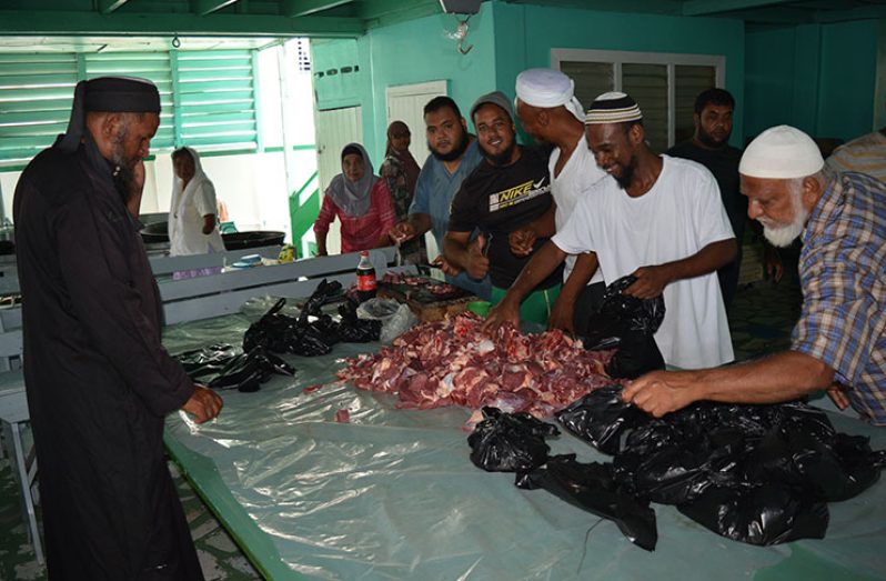 Members of the Kitty Masjid preparing beef parcels for distribution (Rabindra Rooplall Photo)