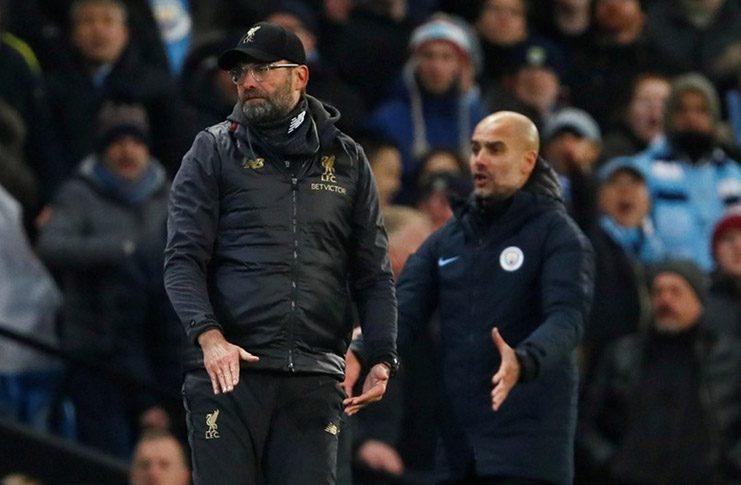 Liverpool manager Juergen Klopp looks on as Manchester City manager Pep Guardiola reacts Action Images via Reuters/Jason Cairnduff