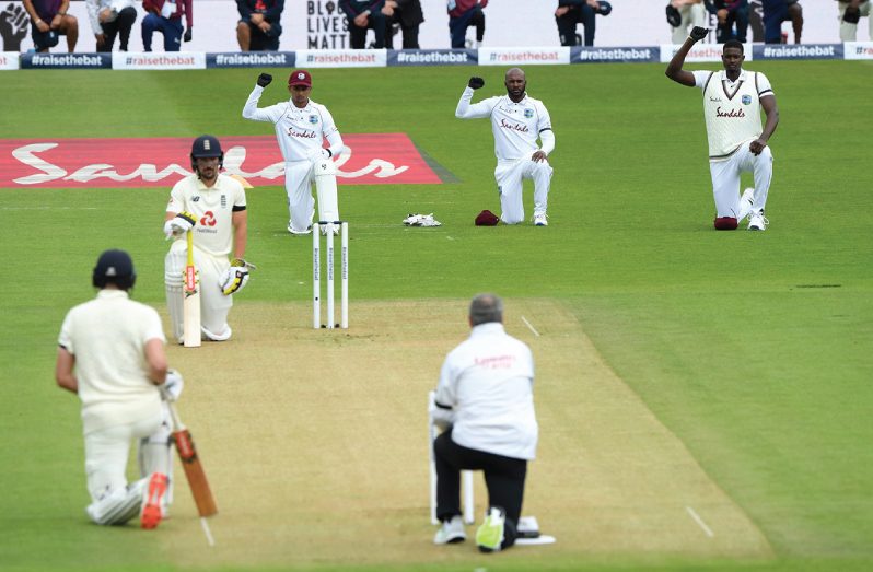 Players from both teams and match officials united in a poignant gesture to support the Black Lives Matter movement before play in the first Test between England and West Indies at the Ageas Bowl.