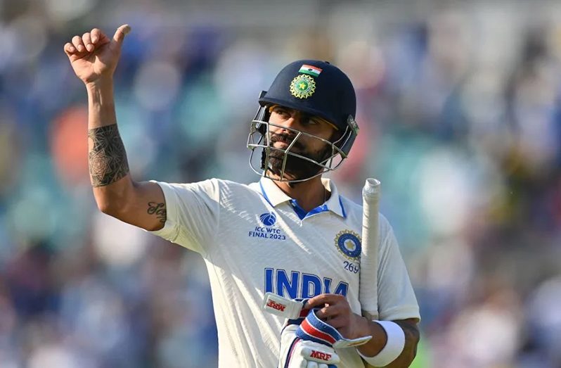 Virat Kohli gives a thumbs up to the crowd at the end of the day's play ( AFP/Getty Images)