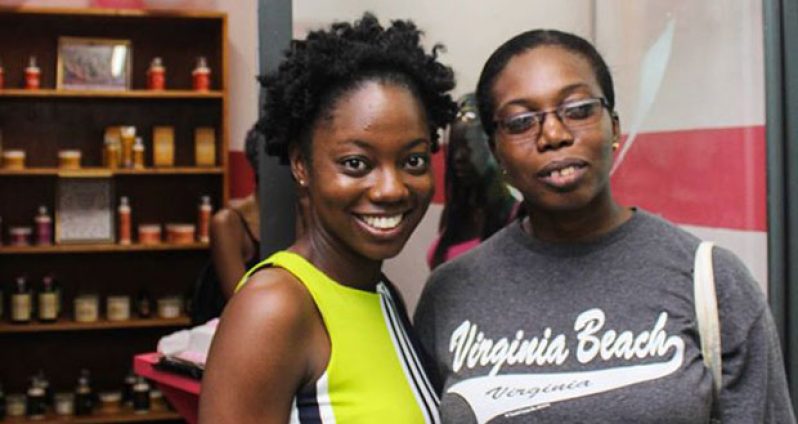 Proprietor, Denisha Victor (left) with a happy customer